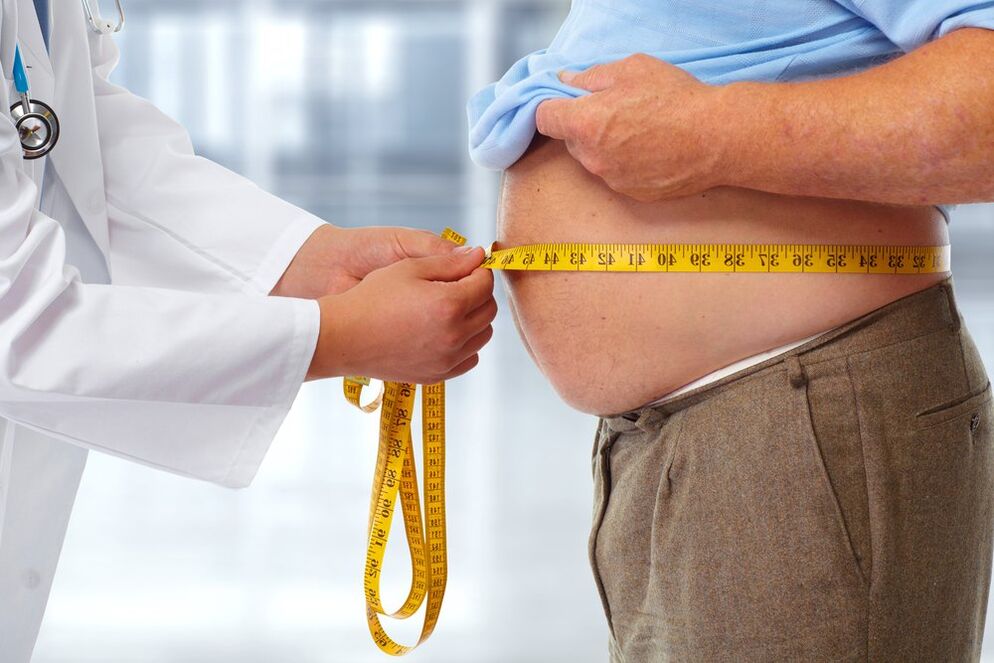 the doctor measures the patient's waist on a diet